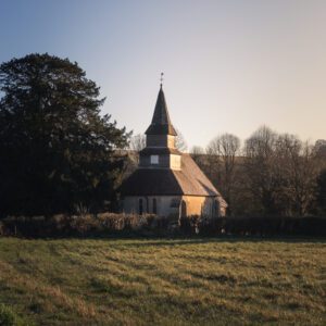 Fine art print of an English village church during the dawn golden hour.